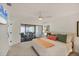 Bedroom features a ceiling fan, and access to the outdoor patio at 3919 Glen Oaks Manor Dr, Sarasota, FL 34232