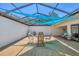 Spacious screened-in patio with comfortable seating and dining, ideal for relaxing and entertaining at 3919 Glen Oaks Manor Dr, Sarasota, FL 34232