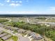 Panoramic aerial view showcasing the community's layout, including houses, ponds, lush greenery, and neighborhood streets at 4015 Quiet Rain Ct, Palmetto, FL 34221
