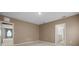 Spacious bedroom with neutral carpet, access to a bathroom, and overhead lighting at 4015 Quiet Rain Ct, Palmetto, FL 34221
