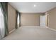 Large, carpeted bedroom featuring neutral colored walls, with natural light at 4015 Quiet Rain Ct, Palmetto, FL 34221