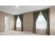 This bedroom has neutral paint and decor with plenty of natural light coming through the windows at 4015 Quiet Rain Ct, Palmetto, FL 34221