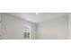 Brightly lit bedroom with neutral paint colors and carpet flooring at 4015 Quiet Rain Ct, Palmetto, FL 34221