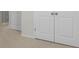 Carpeted flooring leading to bedroom and linen closet at 4015 Quiet Rain Ct, Palmetto, FL 34221