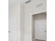 Hallway with white doors and white walls at 4015 Quiet Rain Ct, Palmetto, FL 34221