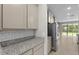 Bright kitchen features granite counters, tile backsplash and stainless-steel appliances at 4015 Quiet Rain Ct, Palmetto, FL 34221