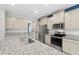 Spacious kitchen with granite counters, stainless-steel appliances and plenty of cabinet space at 4015 Quiet Rain Ct, Palmetto, FL 34221