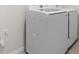 Modern, white, front-loading washer and dryer at 4015 Quiet Rain Ct, Palmetto, FL 34221