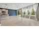 Large living room with great natural light from the large window and sliding glass doors at 4015 Quiet Rain Ct, Palmetto, FL 34221
