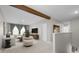 Bright living room with stylish furniture, a beam accent, and modern decor at 4015 Quiet Rain Ct, Palmetto, FL 34221