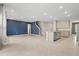Spacious living area with kitchen, island, tile flooring and sliding glass door to back yard at 4015 Quiet Rain Ct, Palmetto, FL 34221