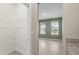 Walk-in pantry with ample shelving and views to green bedroom with sunny windows at 4015 Quiet Rain Ct, Palmetto, FL 34221