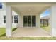An open patio with a roof, offering a cool and shady space for outdoor relaxation and entertainment at 4015 Quiet Rain Ct, Palmetto, FL 34221