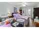 Bright bedroom with wood flooring and a personal workspace, perfect for creative projects at 4189 Heron Way # 406E, Bradenton, FL 34205