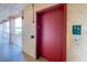 Convenient elevator access in the condo building with safety signage and well-lit hallway at 4189 Heron Way # 406E, Bradenton, FL 34205