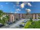 Well-maintained condo building with parking and manicured landscaping in a serene setting at 4189 Heron Way # 406E, Bradenton, FL 34205
