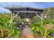 Community gazebo with sitting area surrounded by lush landscaping at 4189 Heron Way # 406E, Bradenton, FL 34205