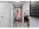 Hallway with doors to a laundry and the outside features wood-look floors at 4189 Heron Way # 406E, Bradenton, FL 34205