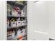 Well-organized linen closet with shelving and storage baskets, maximizing space and accessibility at 4189 Heron Way # 406E, Bradenton, FL 34205