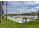 Community shuffleboard courts with benches located near the lake at 4189 Heron Way # 406E, Bradenton, FL 34205