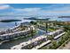 Stunning aerial view of waterfront condos with boat docks and beautiful bay views at 4310 Falmouth Dr # 105, Longboat Key, FL 34228