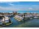 An aerial view showcases waterfront condo community, with pool and boat access to the Gulf at 4310 Falmouth Dr # 105, Longboat Key, FL 34228