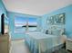 Bright bedroom featuring a view of the water, light-colored walls, and a cozy bed at 4310 Falmouth Dr # 105, Longboat Key, FL 34228