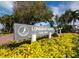 Longboat Harbour community sign with lush landscaping and clear signage at 4310 Falmouth Dr # 105, Longboat Key, FL 34228