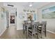 Cozy dining area with seating for four, light-colored walls, and nautical decorations at 4310 Falmouth Dr # 105, Longboat Key, FL 34228