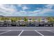 Multi-story condominium with covered parking and lush tropical landscaping of palm trees at 4310 Falmouth Dr # 105, Longboat Key, FL 34228
