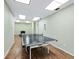 Bright game room featuring a ping pong table on a hardwood floor with neutral-colored walls at 4310 Falmouth Dr # 105, Longboat Key, FL 34228