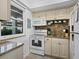 Well-equipped kitchen features appliances, granite counters, and ample cabinet space at 4310 Falmouth Dr # 105, Longboat Key, FL 34228