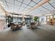Cozy lounge area featuring wicker furniture, brick accents, and natural lighting at 4310 Falmouth Dr # 105, Longboat Key, FL 34228