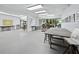 Bright studio with white walls, tables, natural light, and ample space for creating art at 4310 Falmouth Dr # 105, Longboat Key, FL 34228