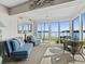 Cozy sunroom with comfortable seating, offering tranquil water views and a relaxing ambiance at 4310 Falmouth Dr # 105, Longboat Key, FL 34228