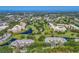 Expansive community aerial featuring golf courses, ponds, and multiple condo buildings, showcasing the beautiful surroundings at 4550 Pinebrook Cir # 608, Bradenton, FL 34209