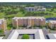 An aerial view shows the condo with beautiful landscaping and golf course views at 4550 Pinebrook Cir # 608, Bradenton, FL 34209