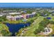 Condo penthouse circled in aerial view, with pool, pond and golf course in a lush, landscaped environment at 4550 Pinebrook Cir # 608, Bradenton, FL 34209