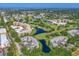 Beautiful aerial view of the community featuring golf courses, lakes, and well-maintained condo buildings at 4550 Pinebrook Cir # 608, Bradenton, FL 34209