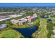 Condo penthouse circled in aerial view, a tranquil pond and golf course create a picturesque residential setting at 4550 Pinebrook Cir # 608, Bradenton, FL 34209
