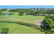 Scenic golf course view with lush green grass, mature trees, and water features in a serene community setting at 4550 Pinebrook Cir # 608, Bradenton, FL 34209