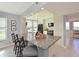 Kitchen island with bar seating and granite countertops is perfect for entertaining at 4550 Pinebrook Cir # 608, Bradenton, FL 34209