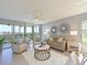 An open living room has stylish furnishings, a ceiling fan, and scenic views at 4550 Pinebrook Cir # 608, Bradenton, FL 34209
