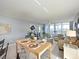 Sun-drenched living area boasts modern decor and views from expansive windows at 4550 Pinebrook Cir # 608, Bradenton, FL 34209