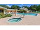 Resort-style pool and hot tub with ample seating for relaxation and leisure at 4550 Pinebrook Cir # 608, Bradenton, FL 34209