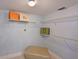 Spacious walk-in closet with ample shelving and an ottoman, ready for personalized organization at 4550 Pinebrook Cir # 608, Bradenton, FL 34209