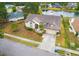 Aerial view of a well-maintained house with landscaping, pond, and neighborhood surroundings at 4621 34Th E Ct, Bradenton, FL 34203