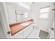 Bright bathroom with a large mirror, spacious vanity, and tiled floors at 4621 34Th E Ct, Bradenton, FL 34203