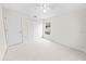 Minimalist bedroom with carpet, a ceiling fan, and a window at 4621 34Th E Ct, Bradenton, FL 34203