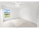 Clean and spacious bedroom with neutral carpet and a window offering serene views at 4621 34Th E Ct, Bradenton, FL 34203